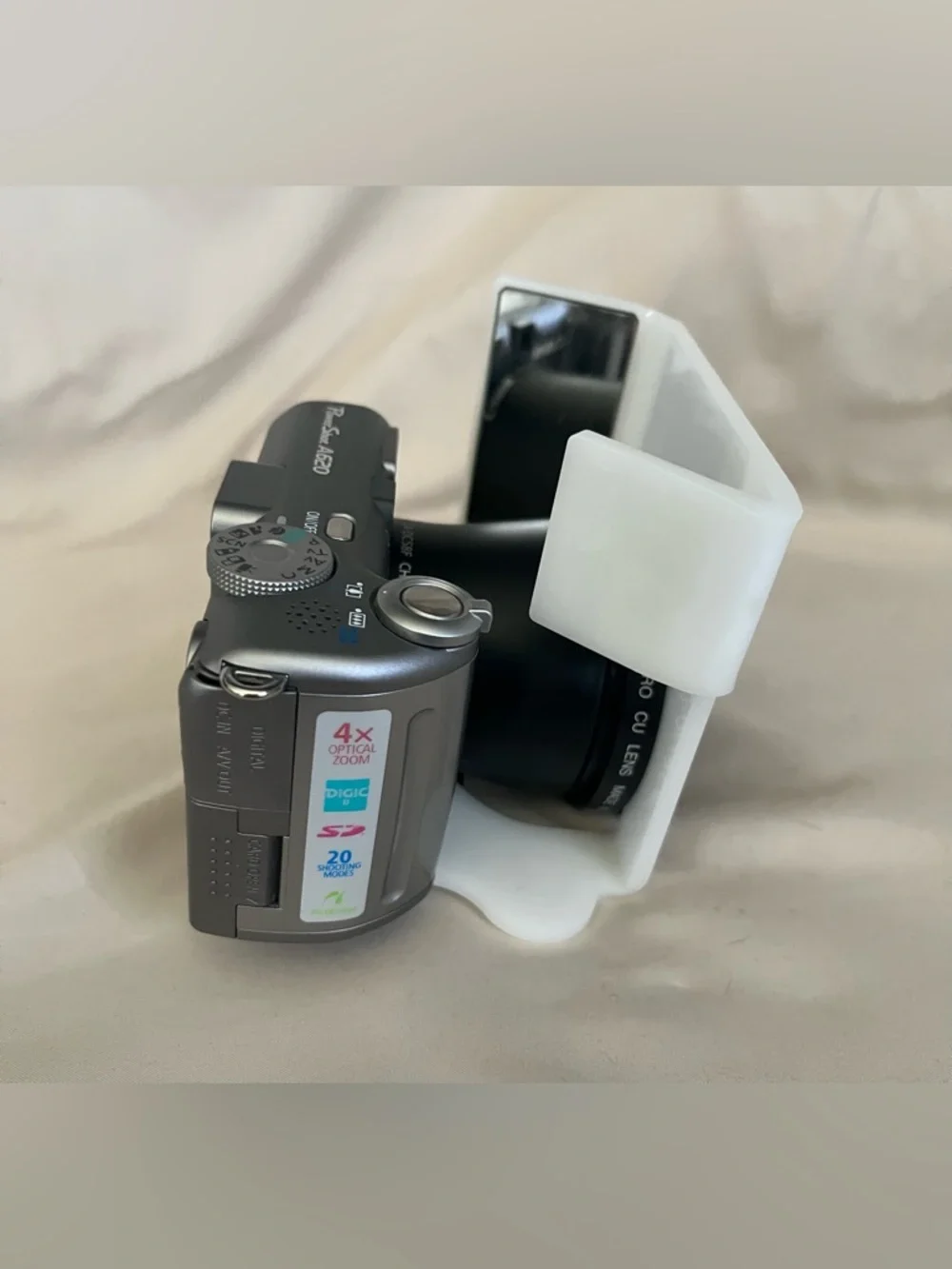 Canon PowerShot A620 digital camera with Photomed dental photography attachment